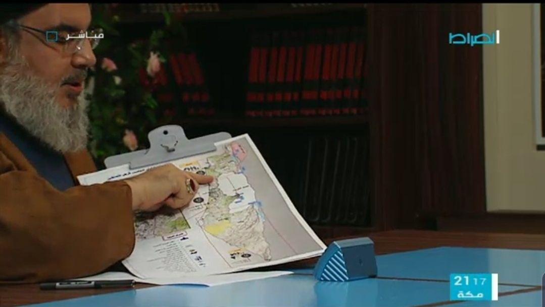 מורתע: נסראללה מציג העתקה של מודל בנק המטרות שפיתח צה"ל מזכ"ל חיזבאללה חסן נצראללה בריאיון מציג את מפת המטרות